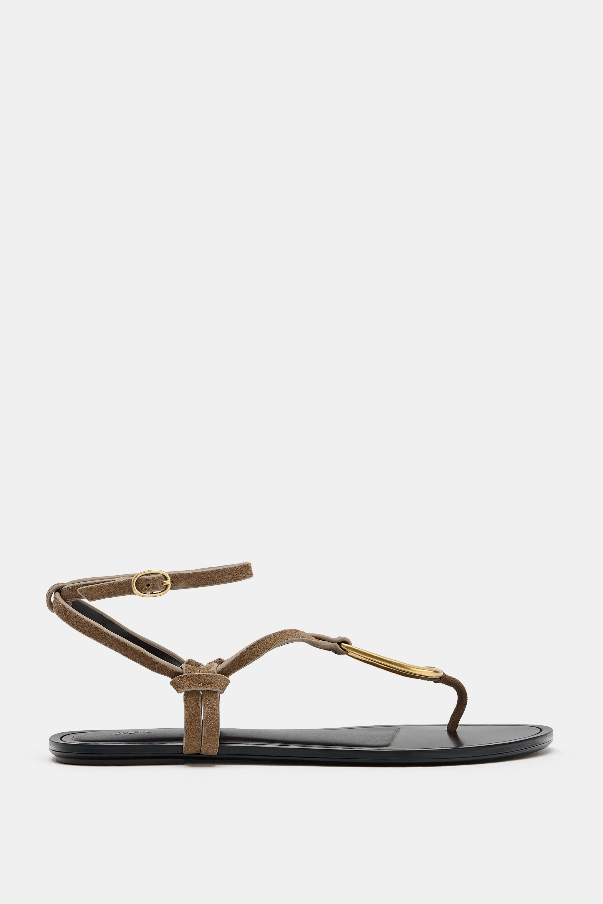 LEATHER SANDALS WITH METALLIC DETAIL